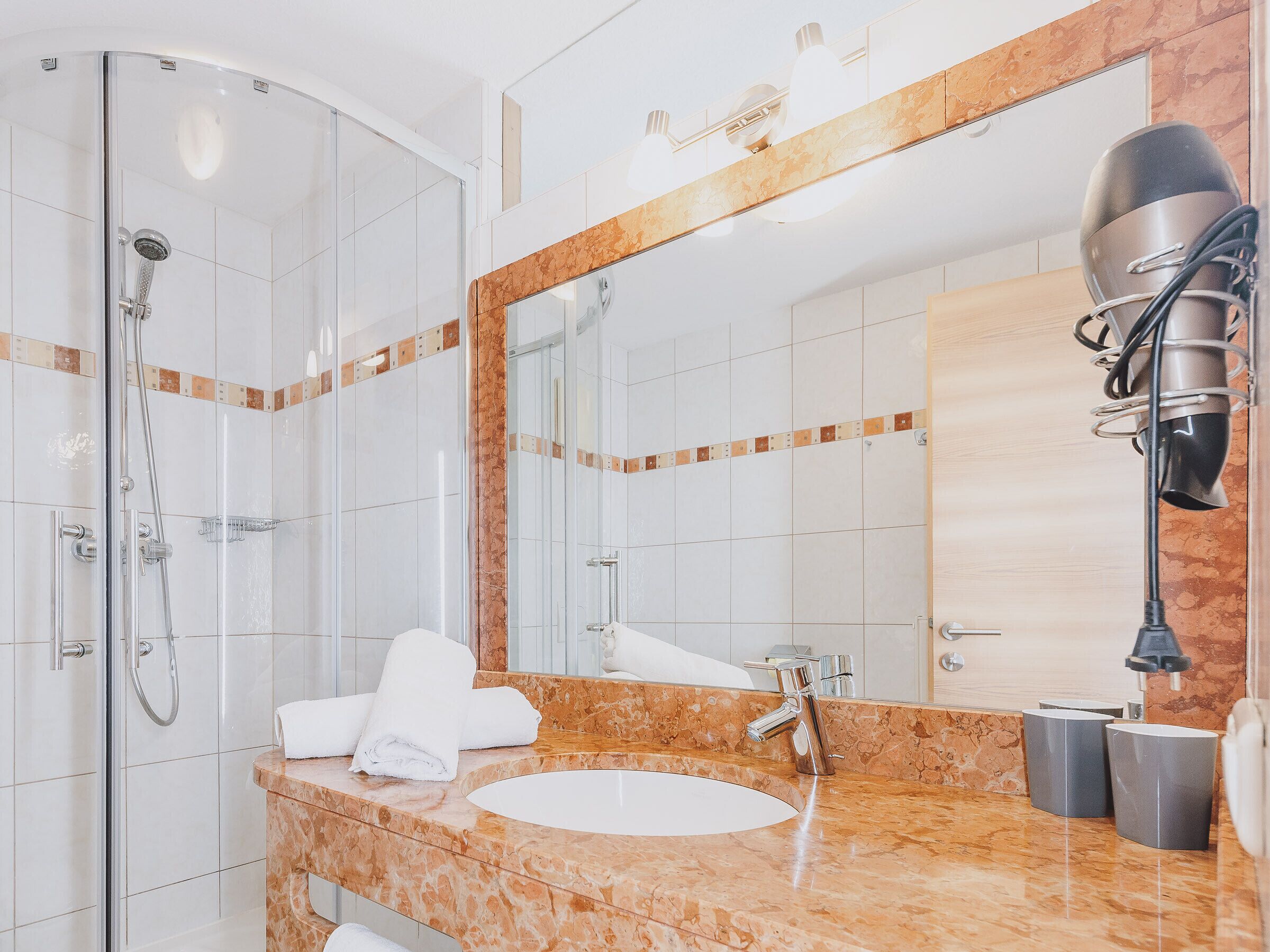 Shower, hair dryer, towels