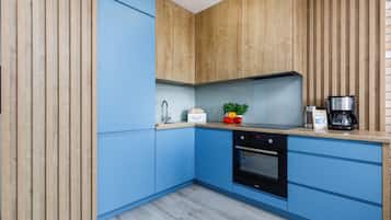 Departamento Royal | Cocina privada | Refrigerador, horno, parrilla de estufa y lavavajillas