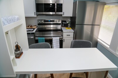 Modern studio cottage with private patio and parking