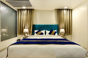 Relax in comfort with a large bed, two bedside tables, and a window with curtains.