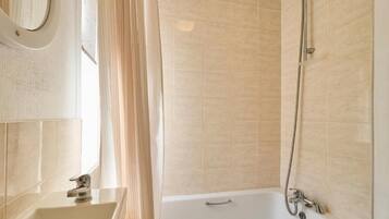 Shower, hair dryer, towels, shampoo