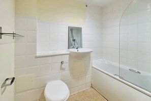 Shower, hair dryer, towels, shampoo