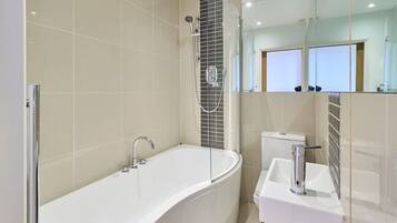 Shower, hair dryer, towels, shampoo