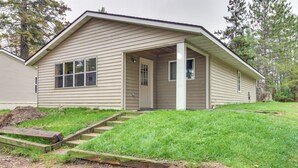 A single-story house with a front porch, a door, and a small window. - Lakefront Bemidji Getaway w/ Community Beach! (Bemidji)