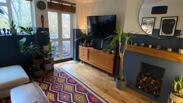 Basic Apartment, Multiple Beds | Living area | TV