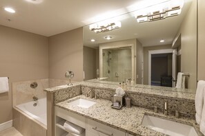 A modern bathroom with two sinks, a large mirror, and a walk-in shower. - River Club 306 2 Bedroom Condo by Alpine Lodging Telluride (Telluride)