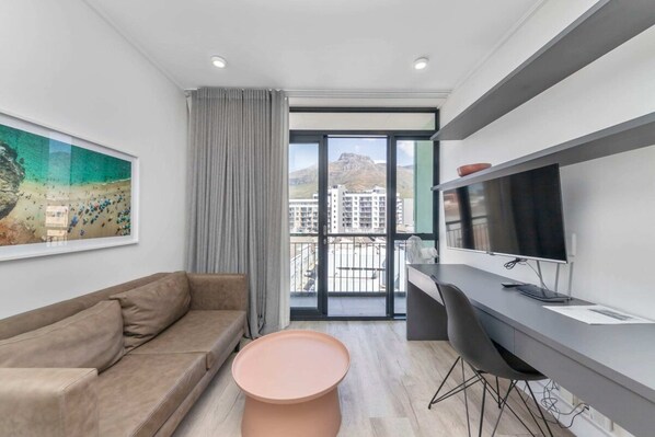 Basic Apartment, 1 Queen Bed | Living area | TV - Stunning Studio Apartment With Balcony, Woodstock! (Cape Town)