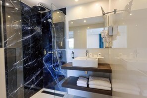 Shower, rainfall showerhead, hair dryer, towels