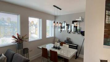 Basic Apartment, Multiple Beds | Living area | TV