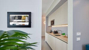 A modern kitchen with a built-in microwave, a sink, and a countertop with various items. - Luxury apartment in the center of Milan - NEW (Milano)