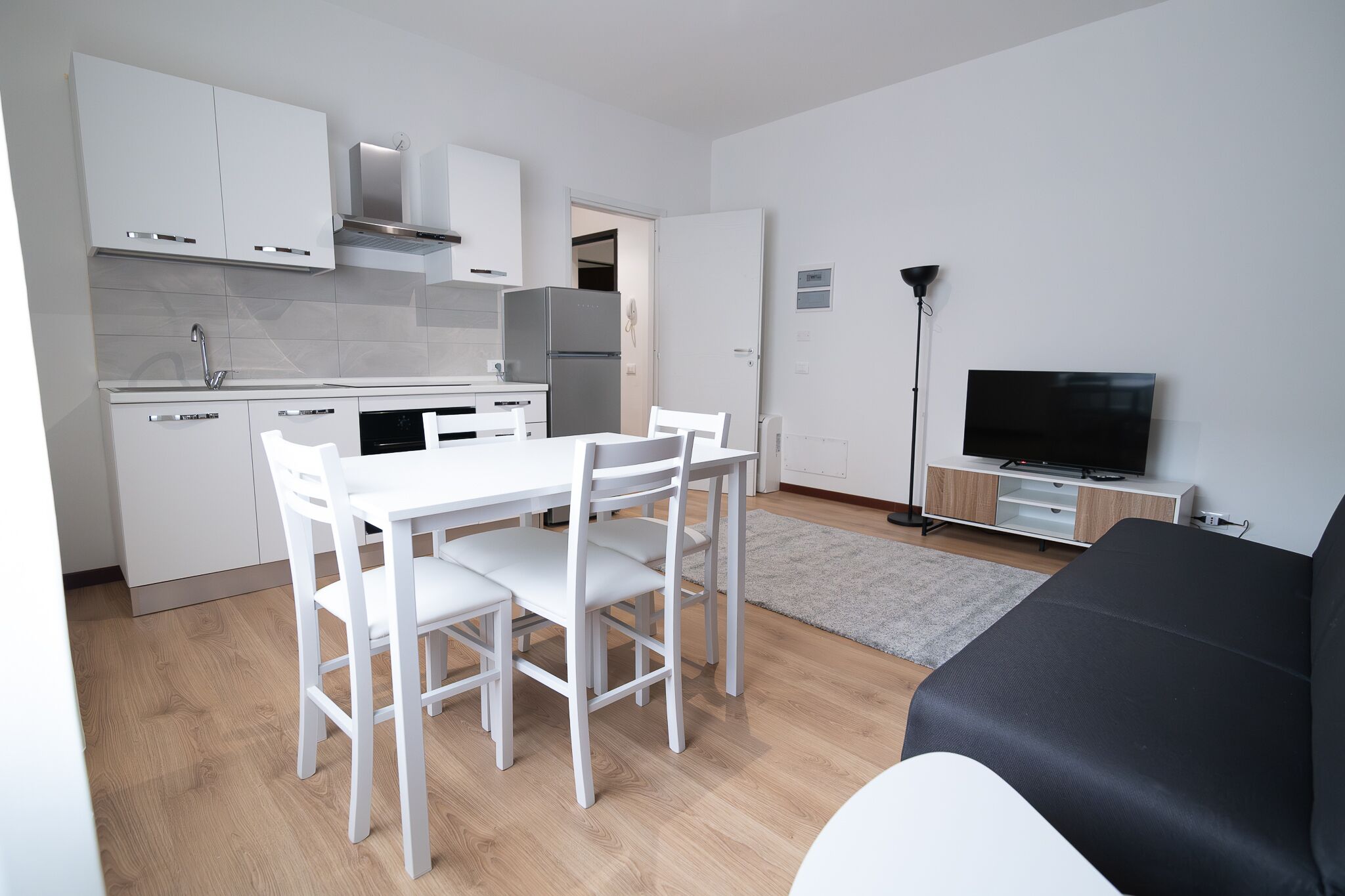 Apartamento Confort | Zona de estar | Una televisión de pantalla plana