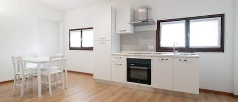 Grand Apartment, 3 Bedrooms, City View | Private kitchen | Full-size fridge, oven, stovetop, highchair