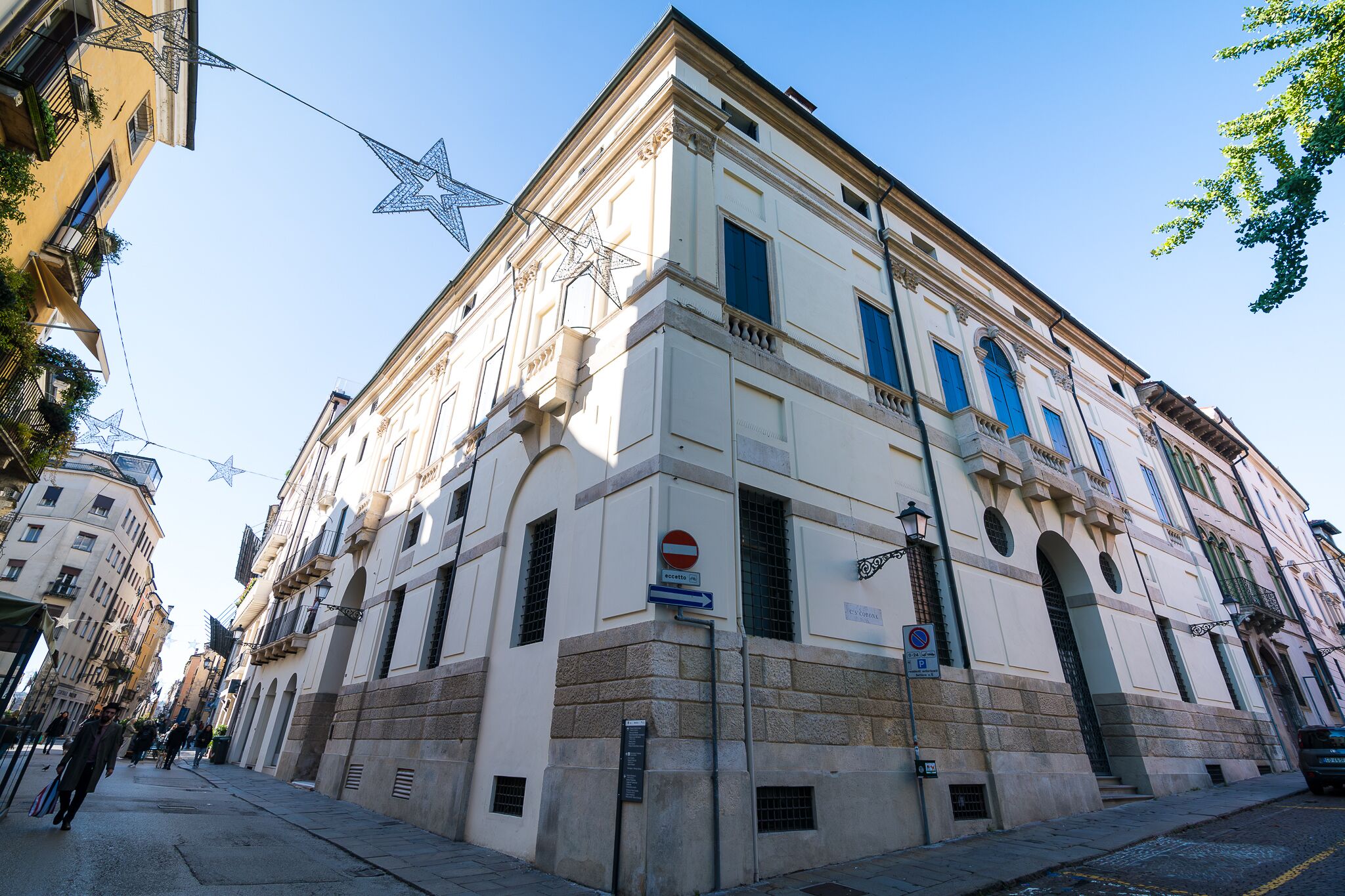 A historic building with classical architecture, a prominent entrance, and a sign indicating a public space.