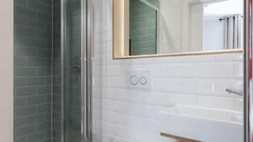 Shower, rainfall showerhead, hair dryer, towels