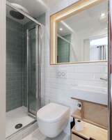 Shower, rainfall showerhead, hair dryer, towels