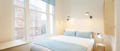 Premium bedding, down duvets, memory-foam beds, desk