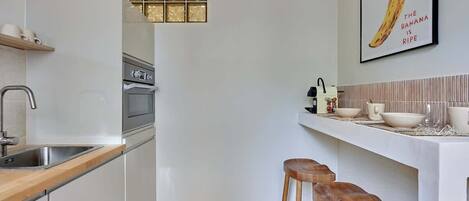 Fridge, microwave, stovetop, coffee/tea maker