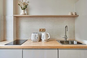 Fridge, microwave, stovetop, coffee/tea maker