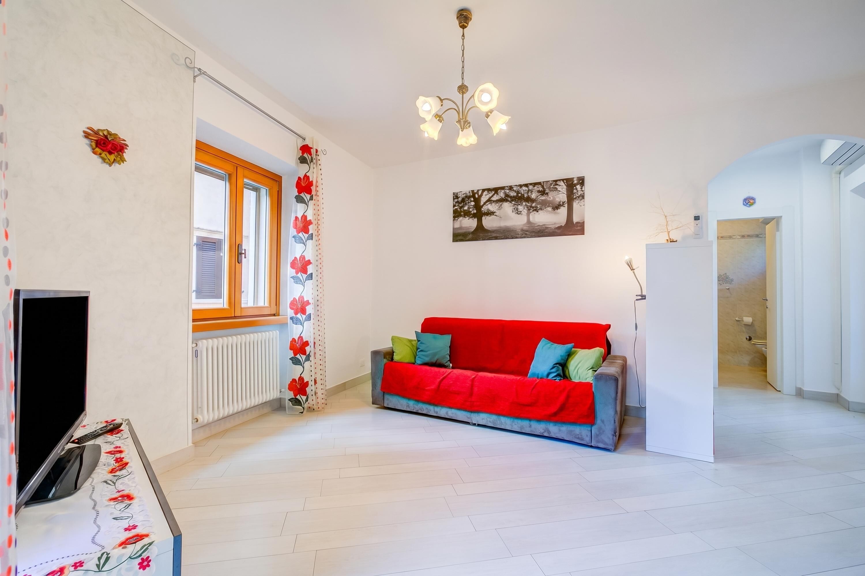 Family Apartment, Multiple Bedrooms, Mountainside (Casa dei Nonni) | Living area | 21-inch flat-screen TV with cable channels