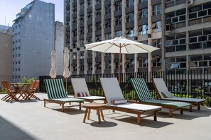 Outdoor pool, open 8:00 AM to 10:00 PM, pool umbrellas, pool loungers