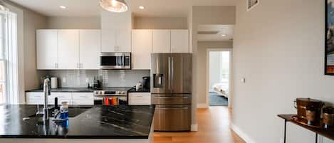 Coupe - 2/1.5 with Main St View | Private kitchen | Full-sized fridge, microwave, oven, stovetop