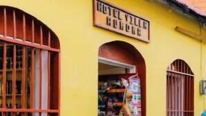A hotel named "Hotel Villa El Valle" with a sign above the entrance. - Hotel Villa Aurora (Flores)