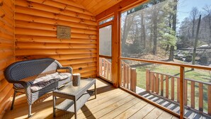 A log cabin with a wooden deck, a bench, and a table. - On-Site Waterfall! Cabin Near Blue Ridge Pkwy (Ennice)