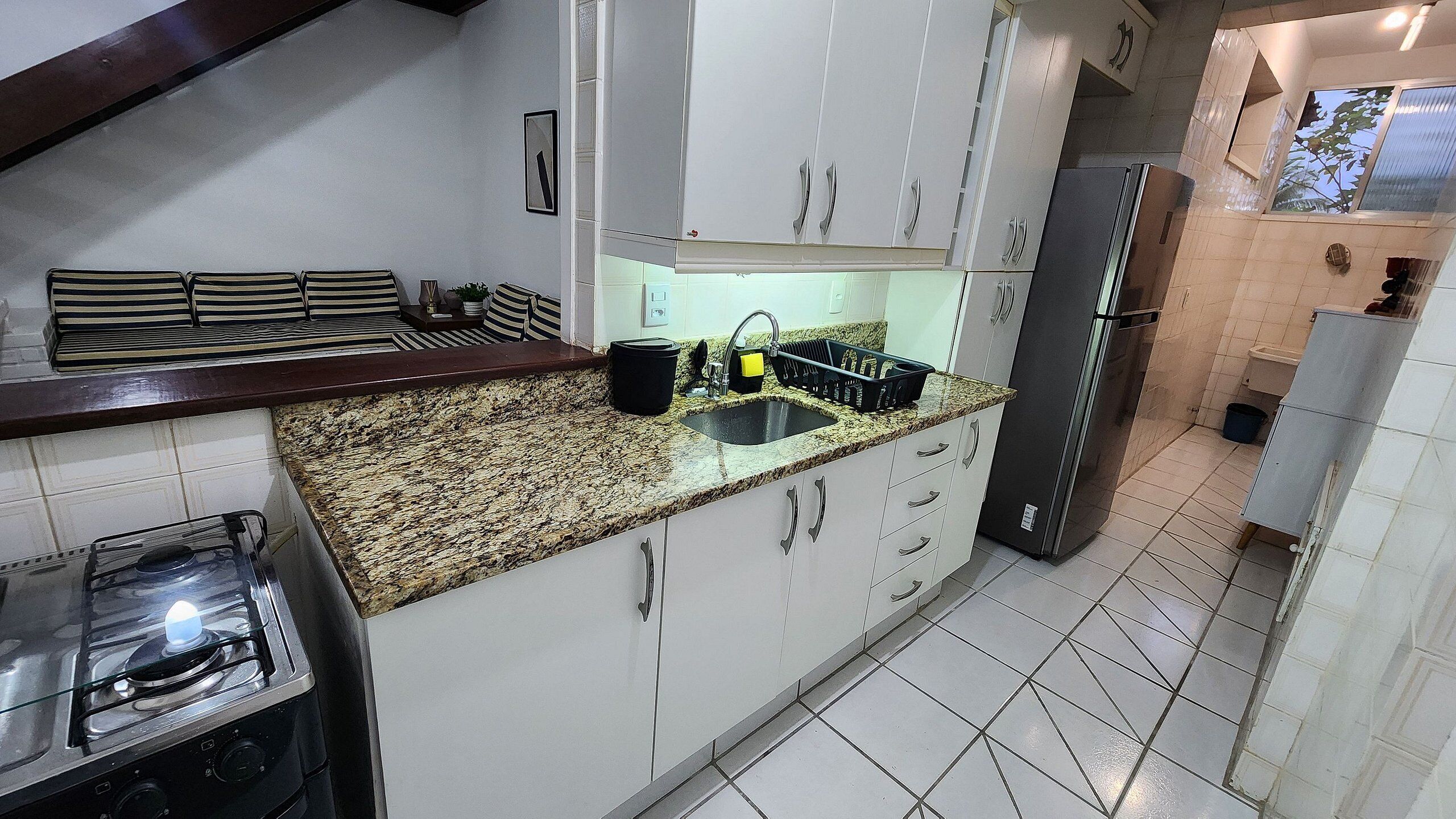 Premium Duplex, Jetted Tub | Private kitchen | Fridge, microwave, cookware/dishes/utensils, dining tables
