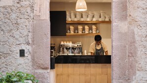 A rustic stone entrance leading to a café with a barista preparing drinks. - Casa 63 Hotel Boutique & Spa (San Miguel de Allende)