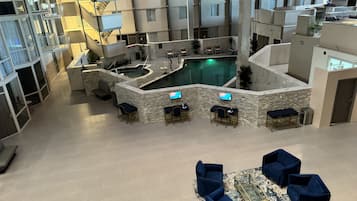 Indoor pool, outdoor pool, open 9:00 AM to 9:00 PM, pool umbrellas