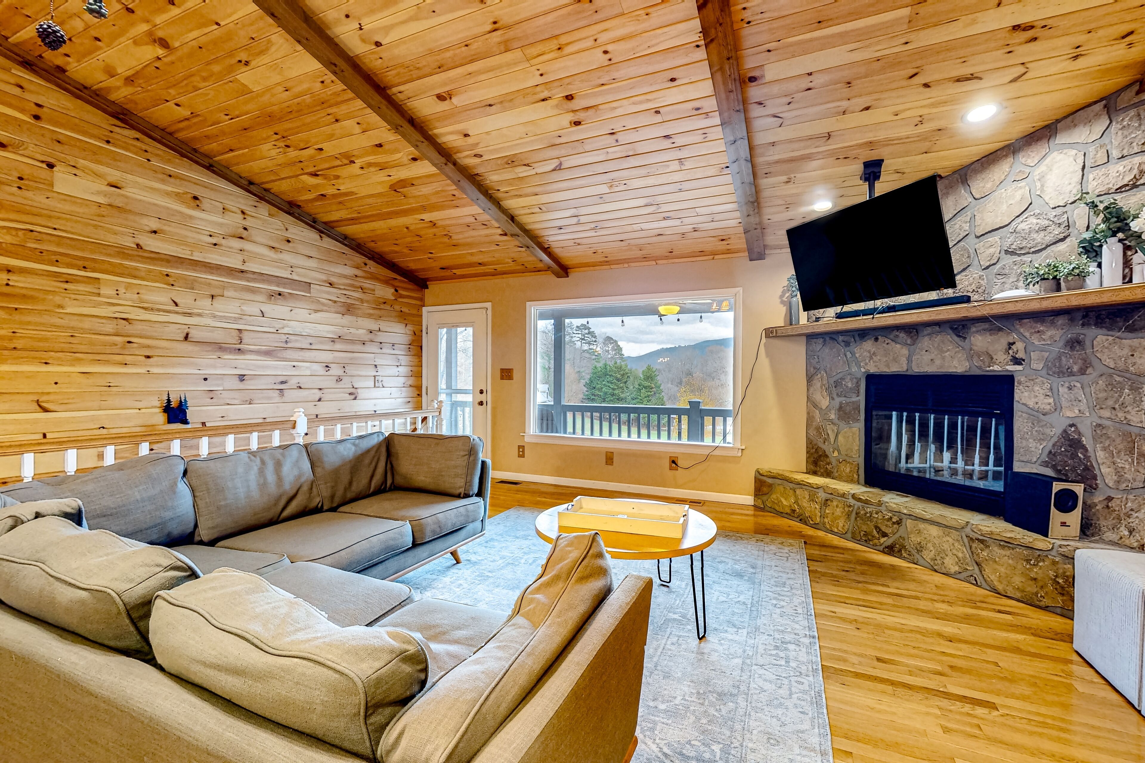 Spacious Smoky Mountain cabin with game room, hot tub, & wood fireplace