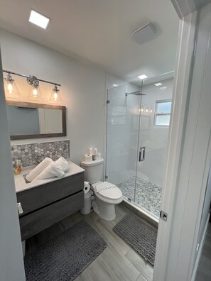 Shower, hair dryer, towels, soap