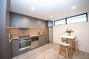 Luxury Apartment, 1 Bedroom, Garden View | Private kitchen | Full-size fridge, microwave, oven, stovetop - Brookside Luxury Apartments (Wanaka)