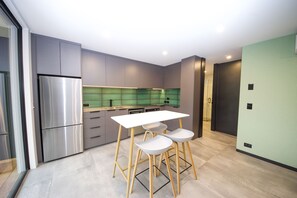 Luxury Apartment, 1 Bedroom, River View | Private kitchen | Full-sized fridge, microwave, oven, stovetop - Brookside Luxury Apartments (Wanaka)
