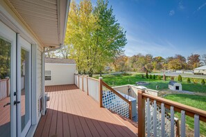 Enjoy a serene view of the neighborhood from this deck.