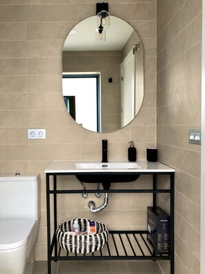 Shower, hair dryer, towels, toilet paper