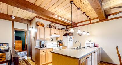 Rustic townhome in a great location with wood stove, grill, balcony, & internet