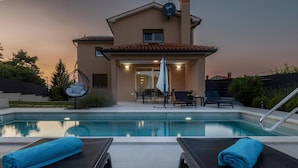 A modern house with a swimming pool, outdoor seating, and a TV antenna. - Gorgeous home in Krsan (Krsan)
