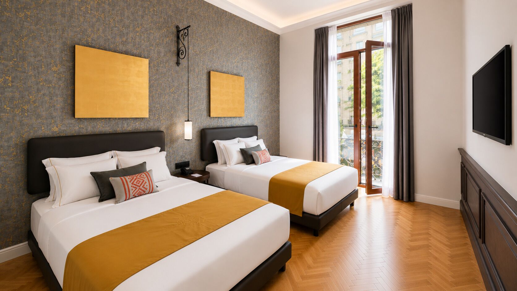 A hotel room with two beds, a large window with curtains, a flat-screen TV, and artwork on the walls.