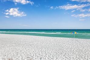 A beach with white sand and a clear blue sky. - South Harbour 2D | Sunset Views | Pensacola Beach | My Beach Getaways (Pensacola Beach)