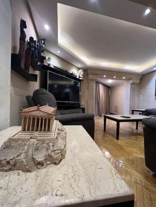 25-inch TV with digital channels, Netflix, streaming services - Rosa Black Baccara Suites (Cairo)