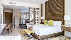 A modern hotel room with a large bed, a desk, and a shower area. - 2 Bedroom Swim Up Suite Cancun (Cancun)