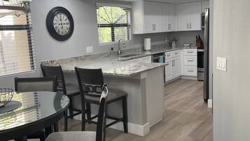 Coffee/tea maker, fridge, microwave, oven