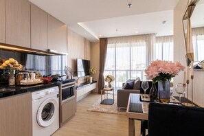 Enjoy a comfortable stay in this well-appointed room with a compact kitchen, flat-screen TV, and city view.