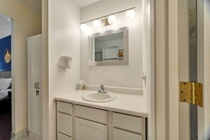 Shower, hair dryer, towels, shampoo
