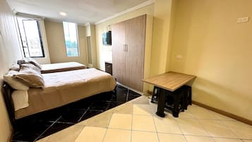 Family Suite, 2 Double Beds | Living area | 42-inch Smart TV with satellite channels