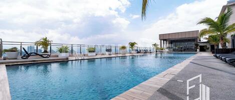 Outdoor pool, open 8:00 AM to 9:00 PM, pool loungers