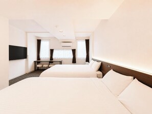 A hotel room with two beds, a desk, a chair, a TV, and an air conditioning unit. - Residence Hotel Liberte (Sapporo)