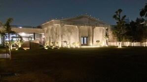 A large, historic building with classical architecture, featuring columns and a central entrance. - Jewels Resorts (Jaipur)