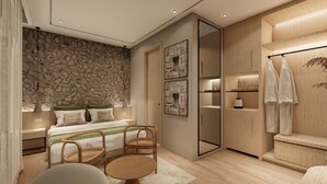 A modern bedroom with a stone wall, a bed with green bedding, a wooden wardrobe, and a seating area with a table and chairs. - Jewels Resorts (Jaipur)